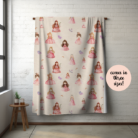a hanging picture of our delightful princess velveteen plush blanket in a room with a stool next to it
